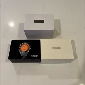 Seiko Silver Watch with Vibrant Orange Dial